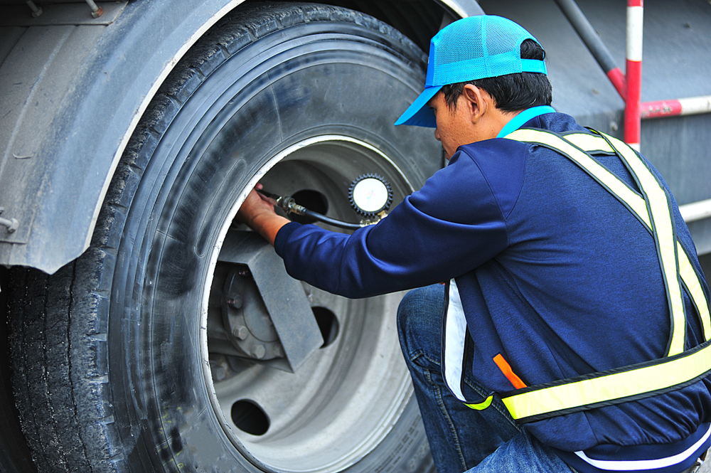 Truck,Driver,Testing,Tyre,Air,Pressure,On,Truck,Tyre