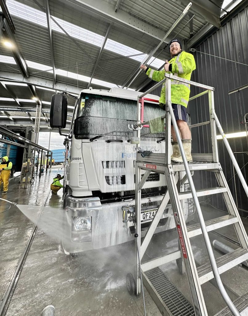 Truckwasher,On,Ladder,Washing,Truck,Windscreen,At,Palmerston,North,CleanCo,Coffee,And,Clean,Afternoon.