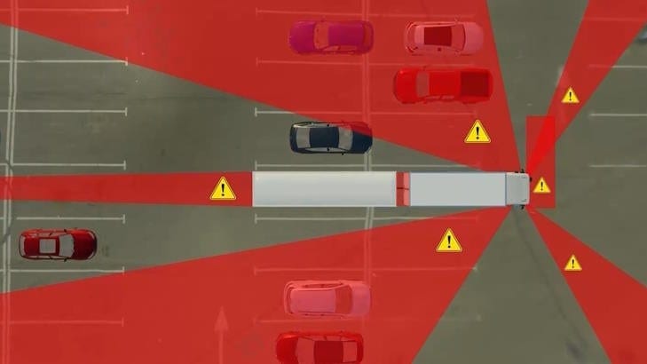 Illustration of truck blind spots, showing triangle warnings.